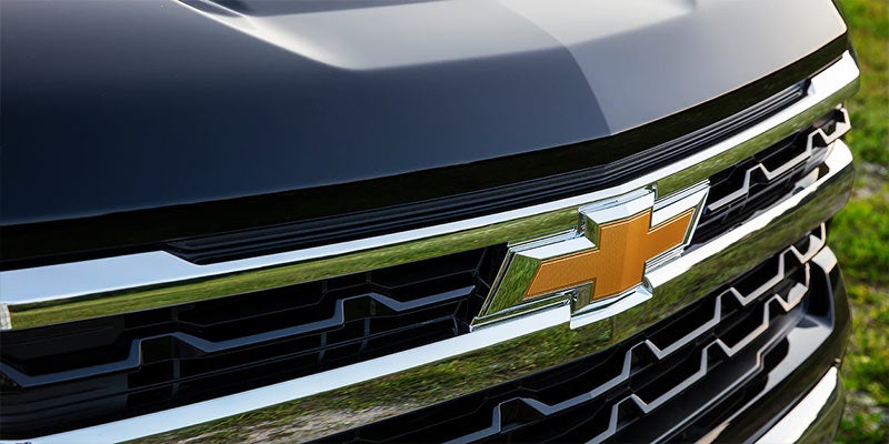 Close-up of the Chevrolet Silverado 1500 grille and logo, highlighting the bold design