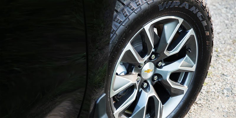 Chevrolet Silverado 1500 wheel, emphasizing its strong, durable design for tough terrains.