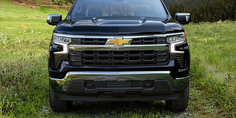 Front view of the Chevrolet Silverado 1500, showcasing its bold grille, iconic logo, and rugged design.